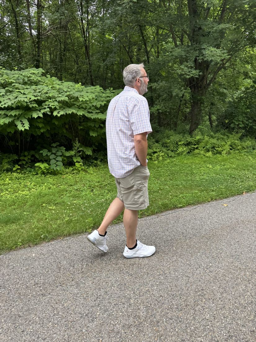 Scott walking outdoors